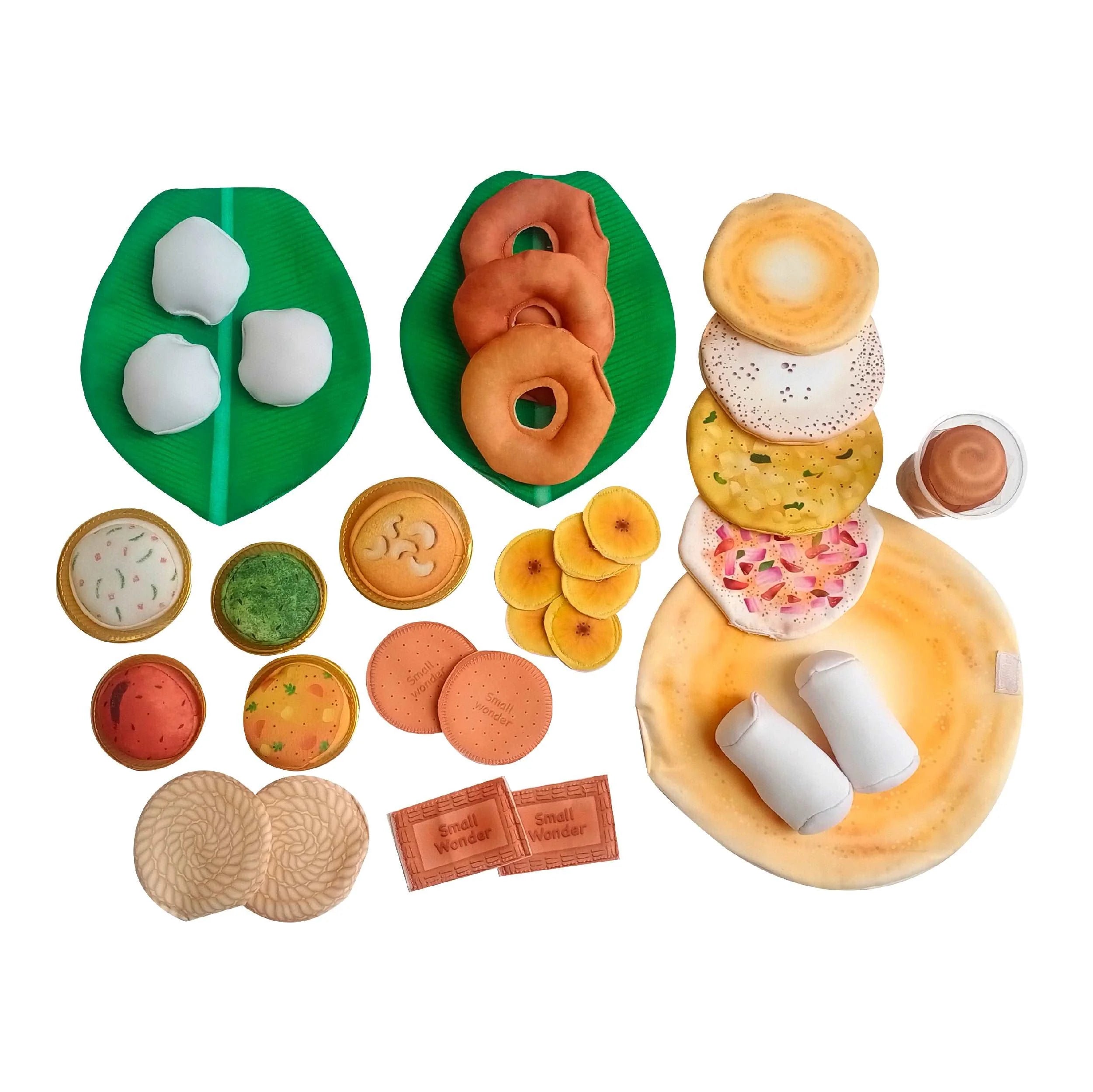 Set of toy food items on a white background
