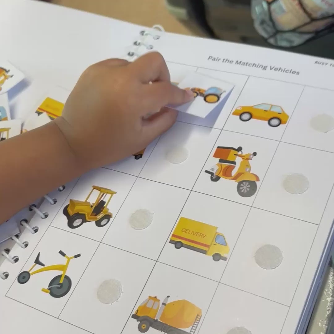 A child fixing the right matches on an activity sheet.